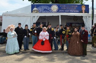 Regiment in front of Comptroller Judy Baar Topinka's tent